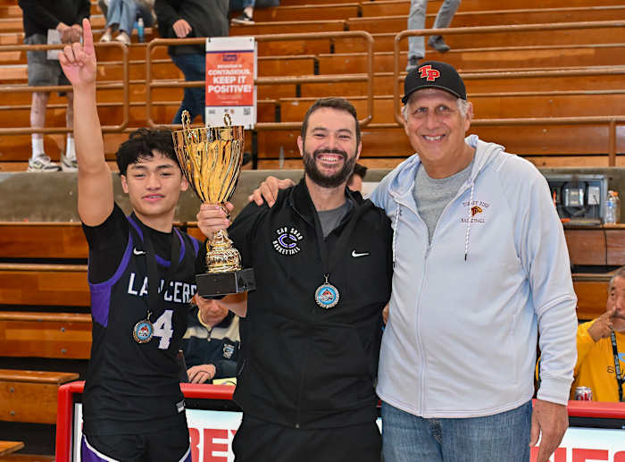 Tristan Guzman (4), Carlsbad Clark Allard and Torrey Pines coach/Holiday Classic Tournament Director John Olive poses after championship.